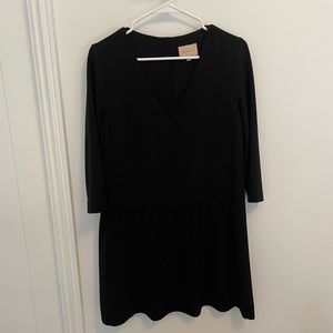 Sezane black drop waist dress with buttons up the back.